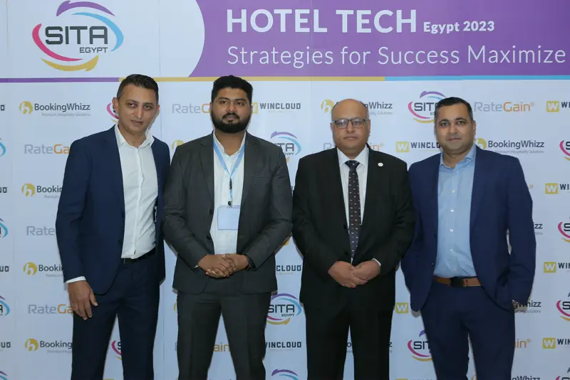 Guests at the Hotel Tech 2023 backdrop