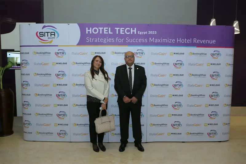 Guests at the Hotel Tech 2023 backdrop