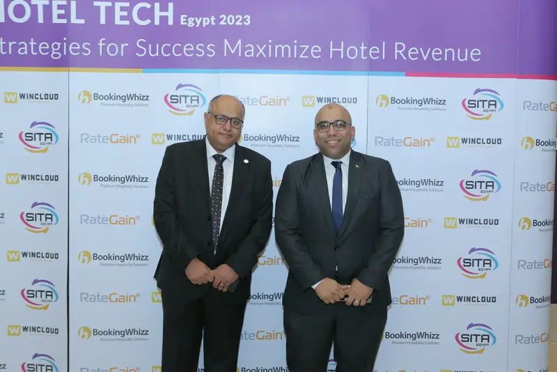 Guests at the Hotel Tech 2023 backdrop