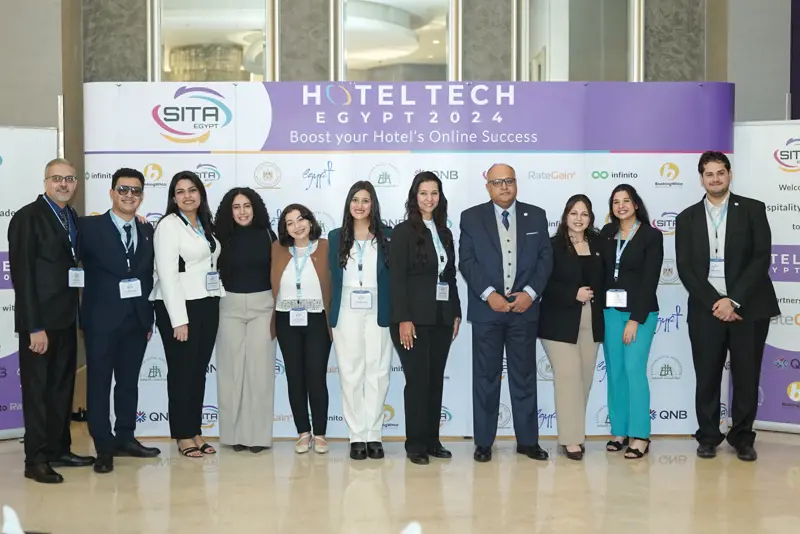 Team photo at the Hotel Tech 2024 backdrop